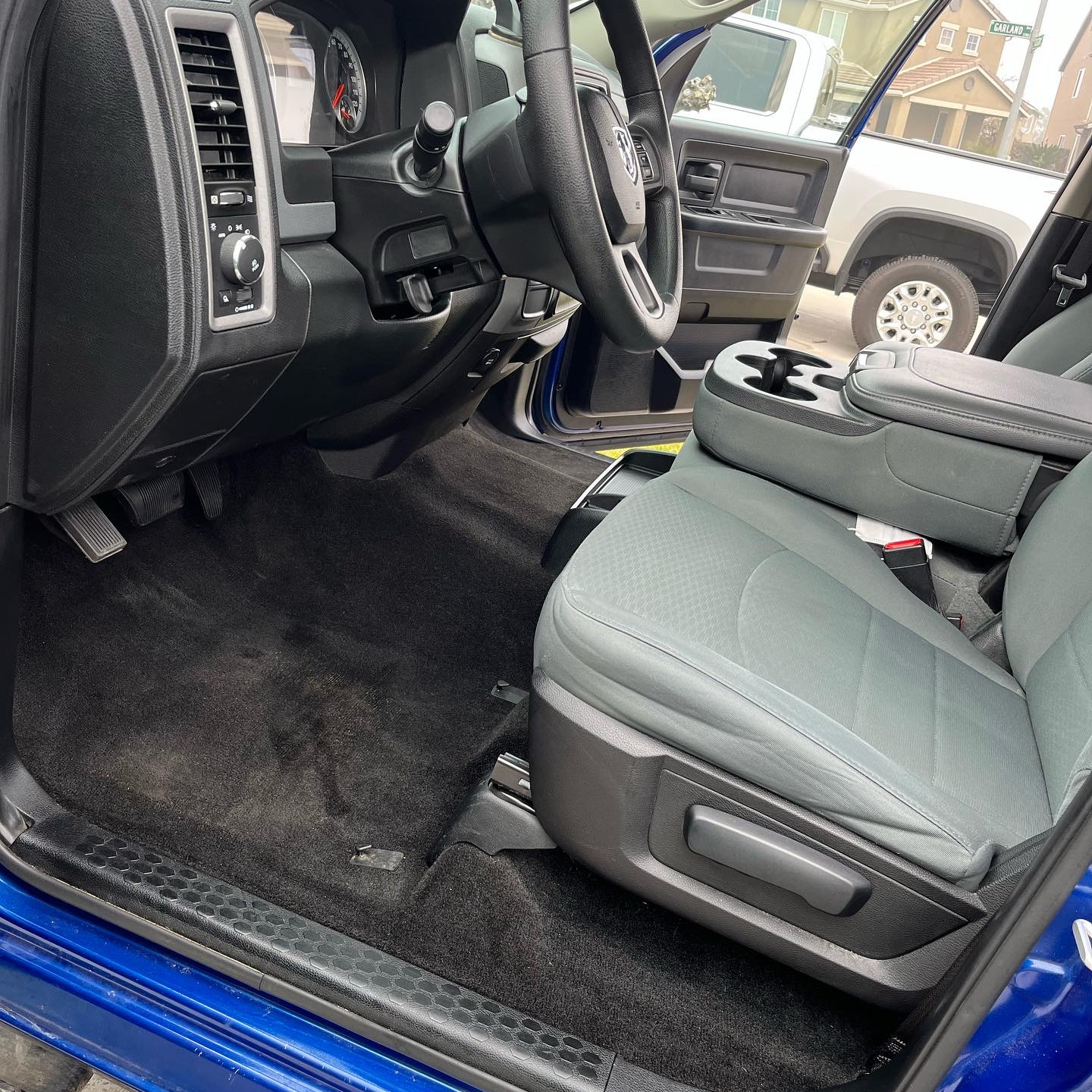 The inside of a car with the door open