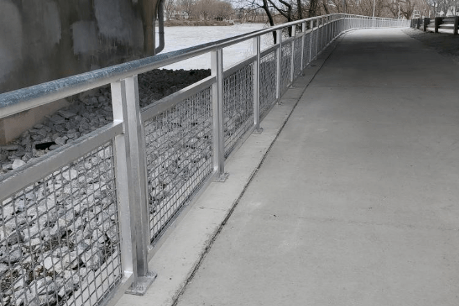 There Is A Metal Fence Along The Side Of A Bridge – Mishawaka IN - Milestone Fence
