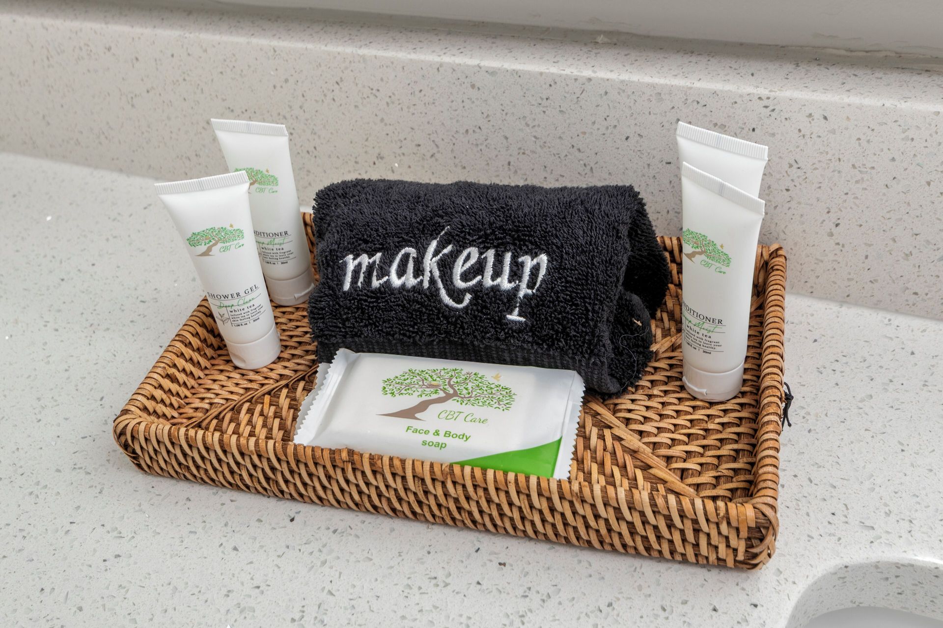Bamboo basket with makeup wipes and tubes on a bathroom counter