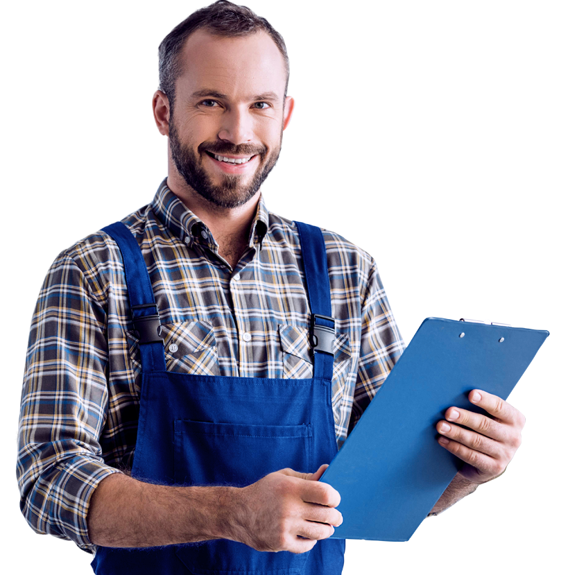 Mechanic holding blue clipboard, smiling. Wearing blue overalls over plaid shirt.