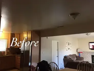 A picture of a kitchen and living room before being remodeled.