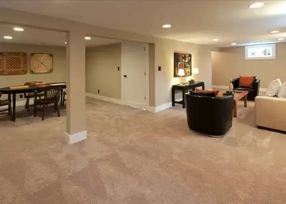 A living room with a couch , chairs and a table.