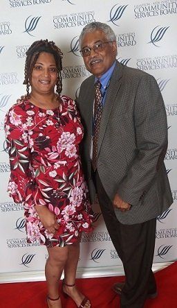 Lisa, 10-years of service recognized employee (L) with the Director of ARTS