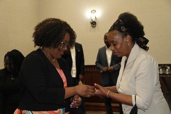 Ramona, 15-years of service recognized employee (R) with the Chief Financial Officer