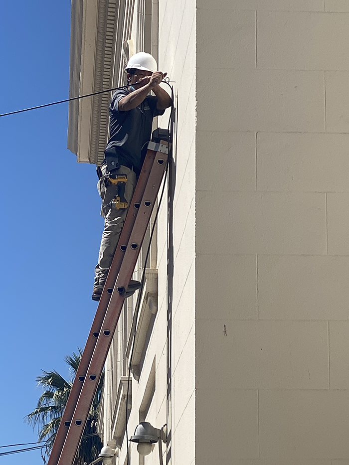 Technicians work to connect Power House Church during the pandemic.