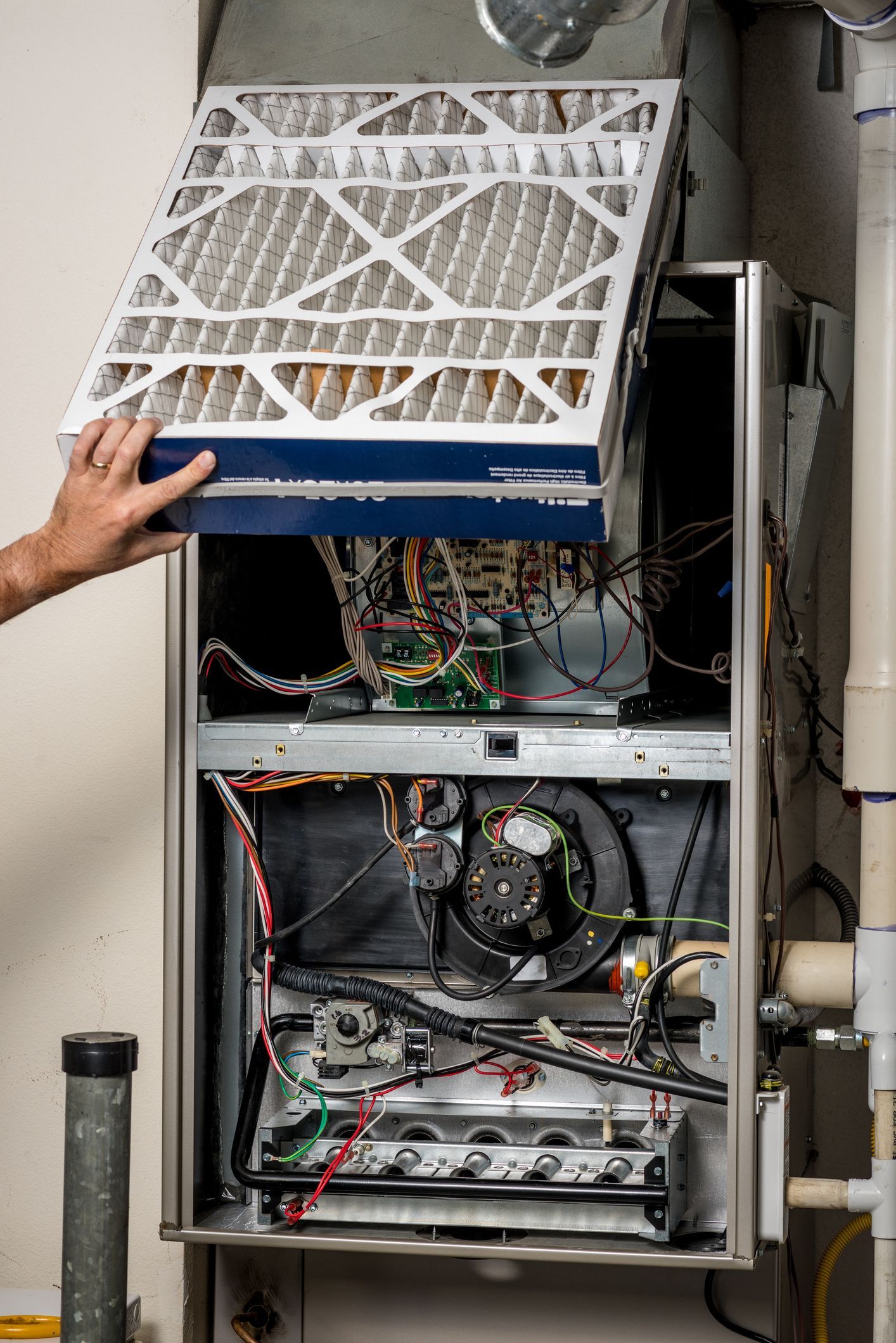 Air Control Company technician providing professional furnace repair services in a residential home in Nicholasville, KY.