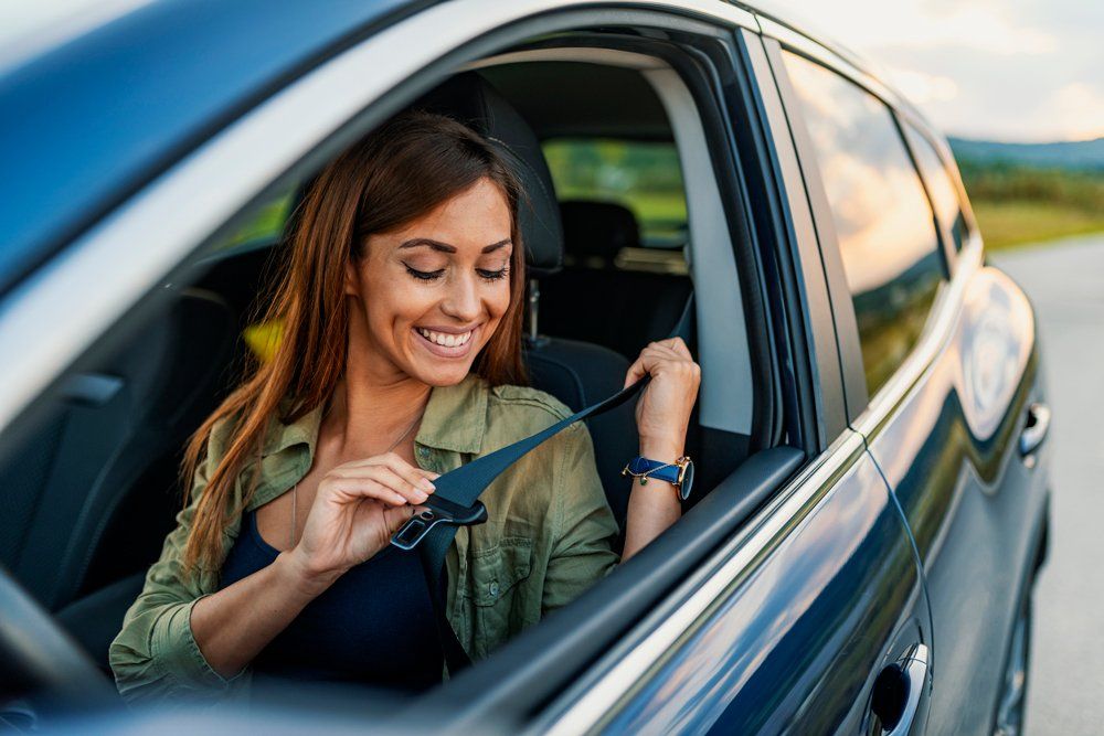 Woman Inside Car Wearing Seatbelt — Scottsdale, AZ — J.B. Martin Insurance Agencies Woman Inside Car Wearing Seatbelt — Scottsdale, AZ — J.B. Martin Insurance Agencies