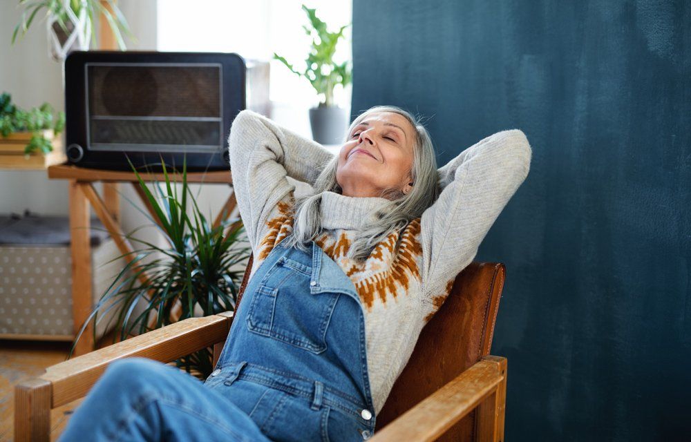 Senior Woman Relaxing At Home — Scottsdale, AZ — J.B. Martin Insurance Agencies Senior Woman Relaxing At Home — Scottsdale, AZ — J.B. Martin Insurance Agencies