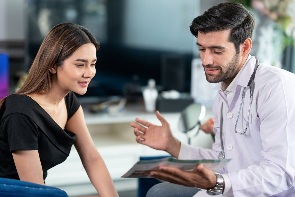 Doctor Holding A Document — Scottsdale, AZ — J.B. Martin Insurance Agencies Doctor Holding A Document — Scottsdale, AZ — J.B. Martin Insurance Agencies