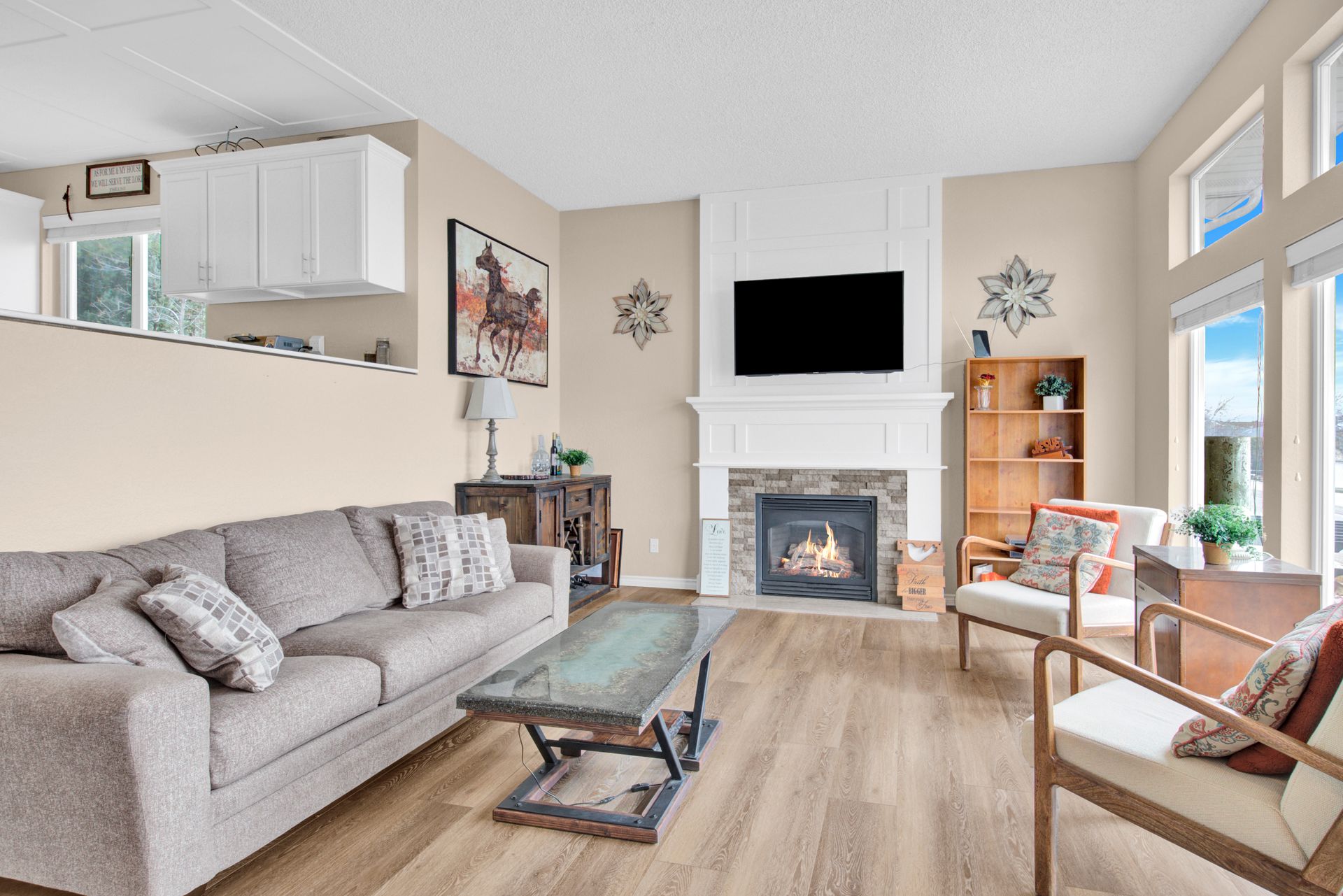 Spacious living room with fireplace and large windows in Great Falls MT home