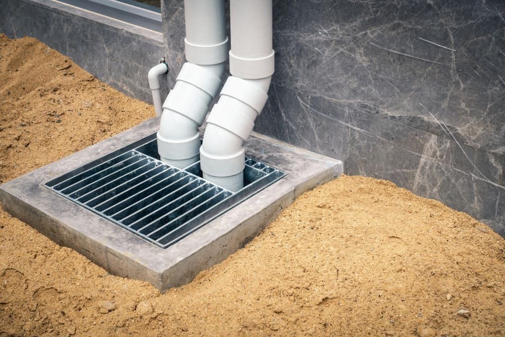 A Drainage System Is Being Installed On The Side Of A House — GPS Plumbing, Drainage & Gasfitting In Narromine, NSW