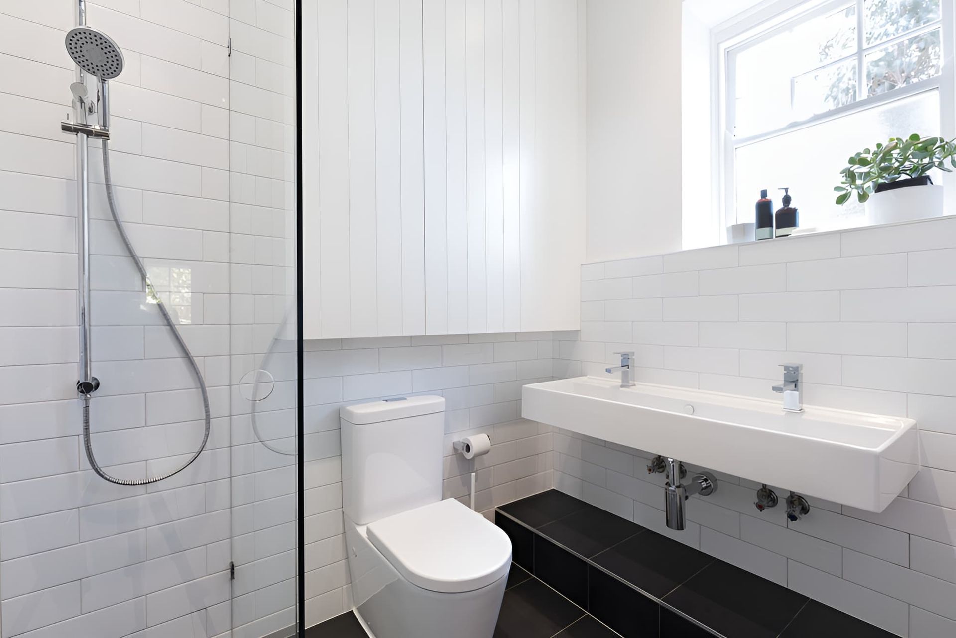 A Bathroom With A Toilet , Sink And Shower — GPS Plumbing, Drainage & Gasfitting In Wellington, NSW