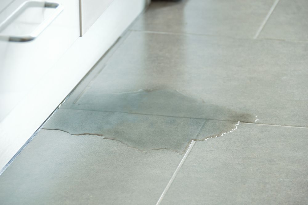 A Water Leak Under The Grey Tiles