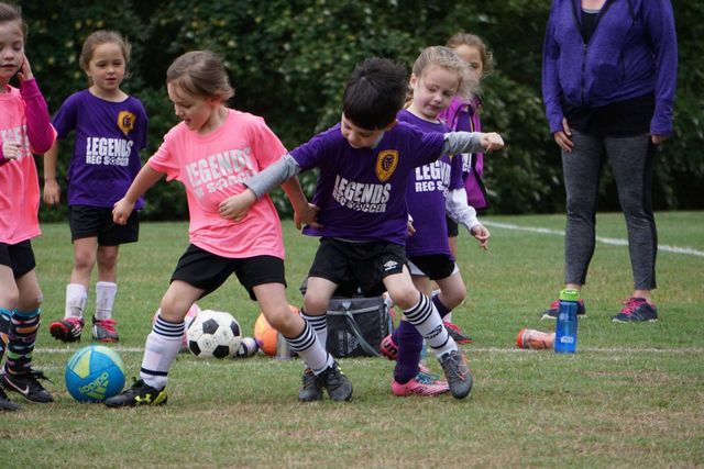 Youth rec players in a soccer game