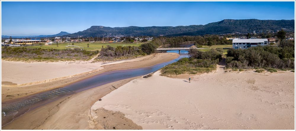 An Aerial View of a River Flowing Through a Sandy Beach — Active Lifestyle Supports In Wollongong, NSW