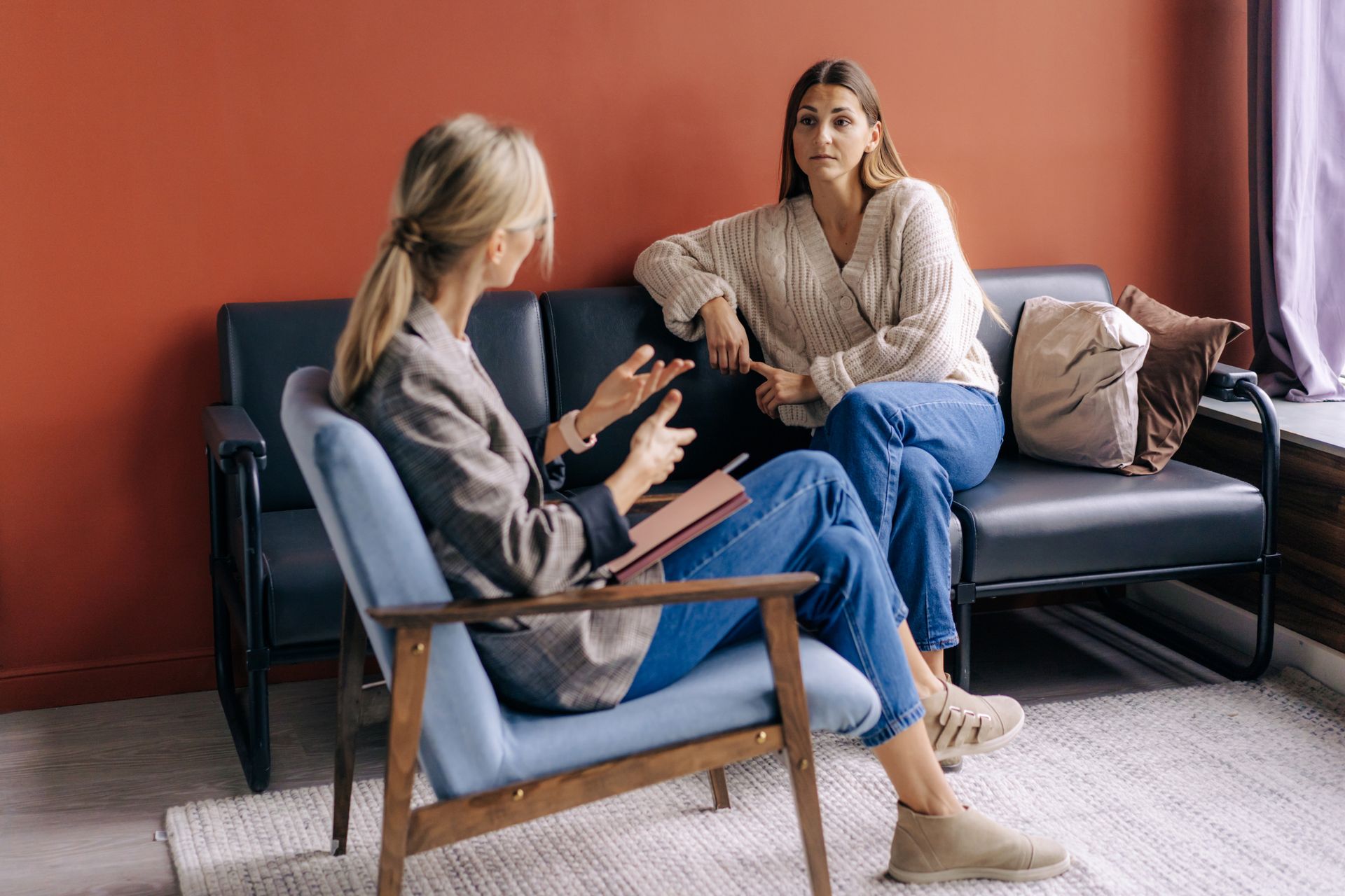 Therapist and client talking during an individual therapy session Therapist and client talking during an individual therapy session