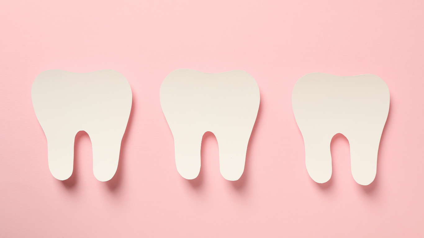 Three white tooth icons on a pink background