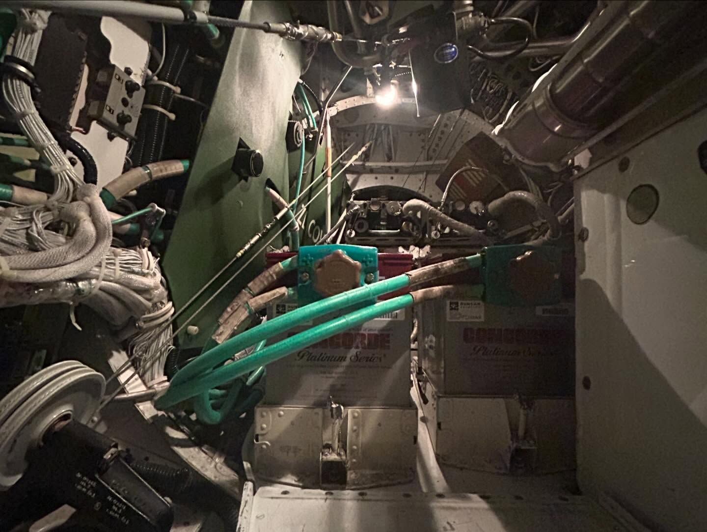 A close up of a machine with a lot of wires coming out of it.