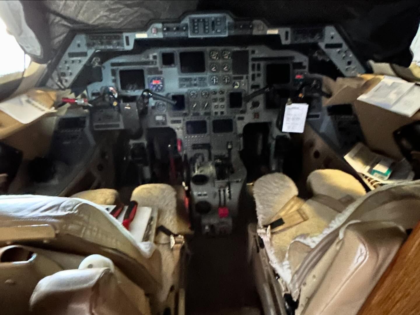 A cockpit of an airplane with a tag that says ' a ' on it