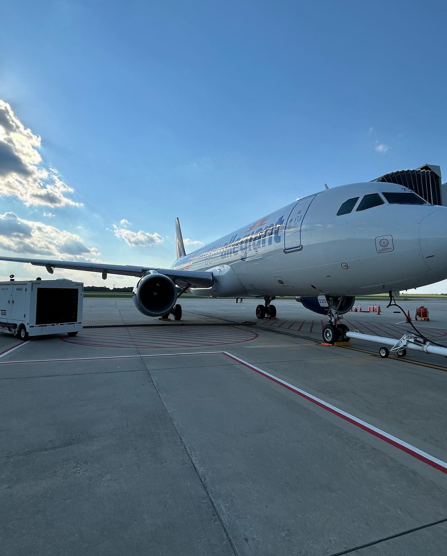 A large passenger jet is parked on the tarmac at an airport.