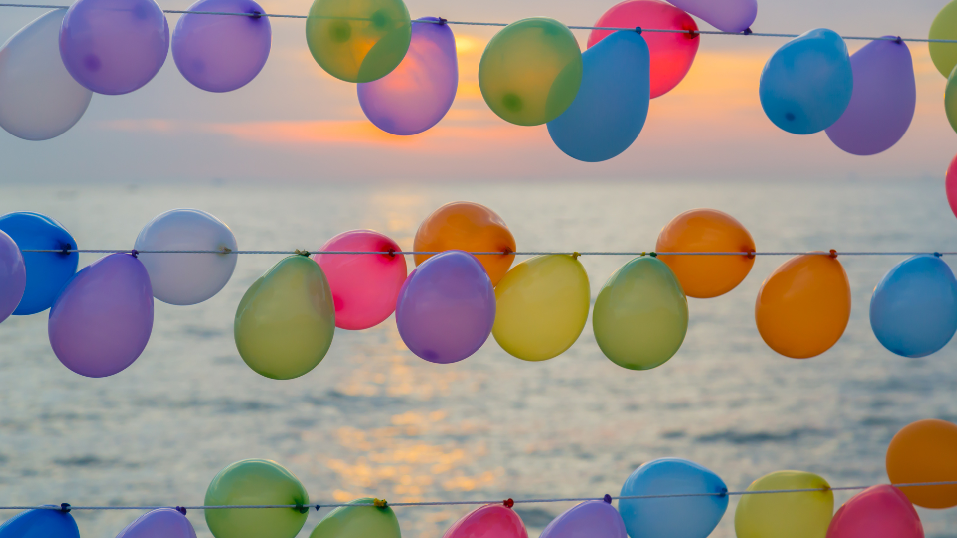 summer party balloons Lake George sunset event