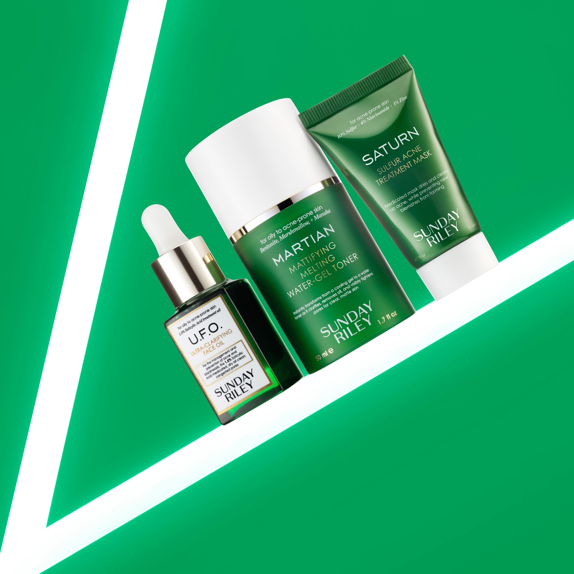 Green skincare products with white accents on a bright green background, arranged diagonally.