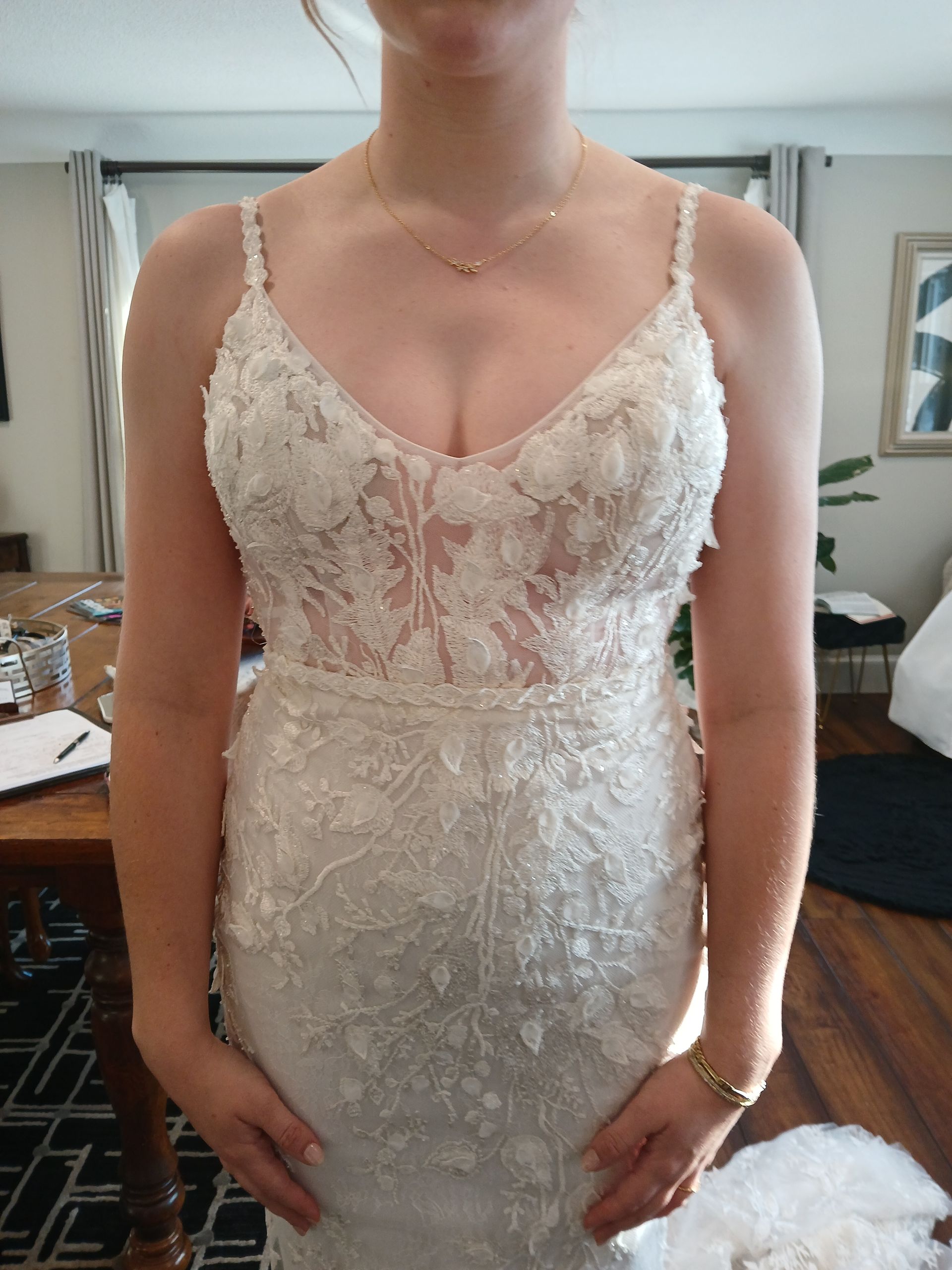 Woman in wedding gown at bridal fitting appointment with Sonya Garcia