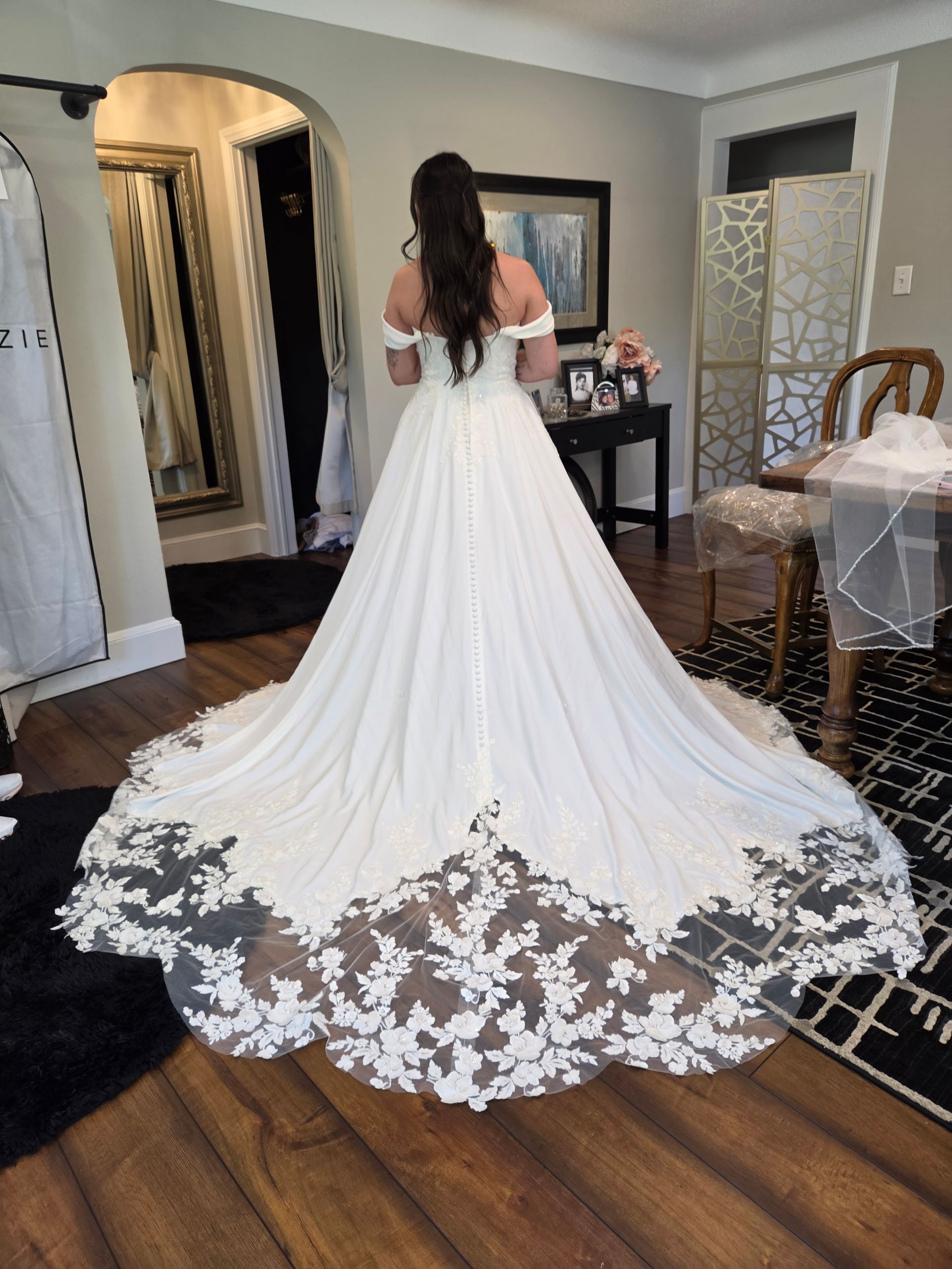 Woman in wedding gown at bridal fitting appointment with Sonya Garcia