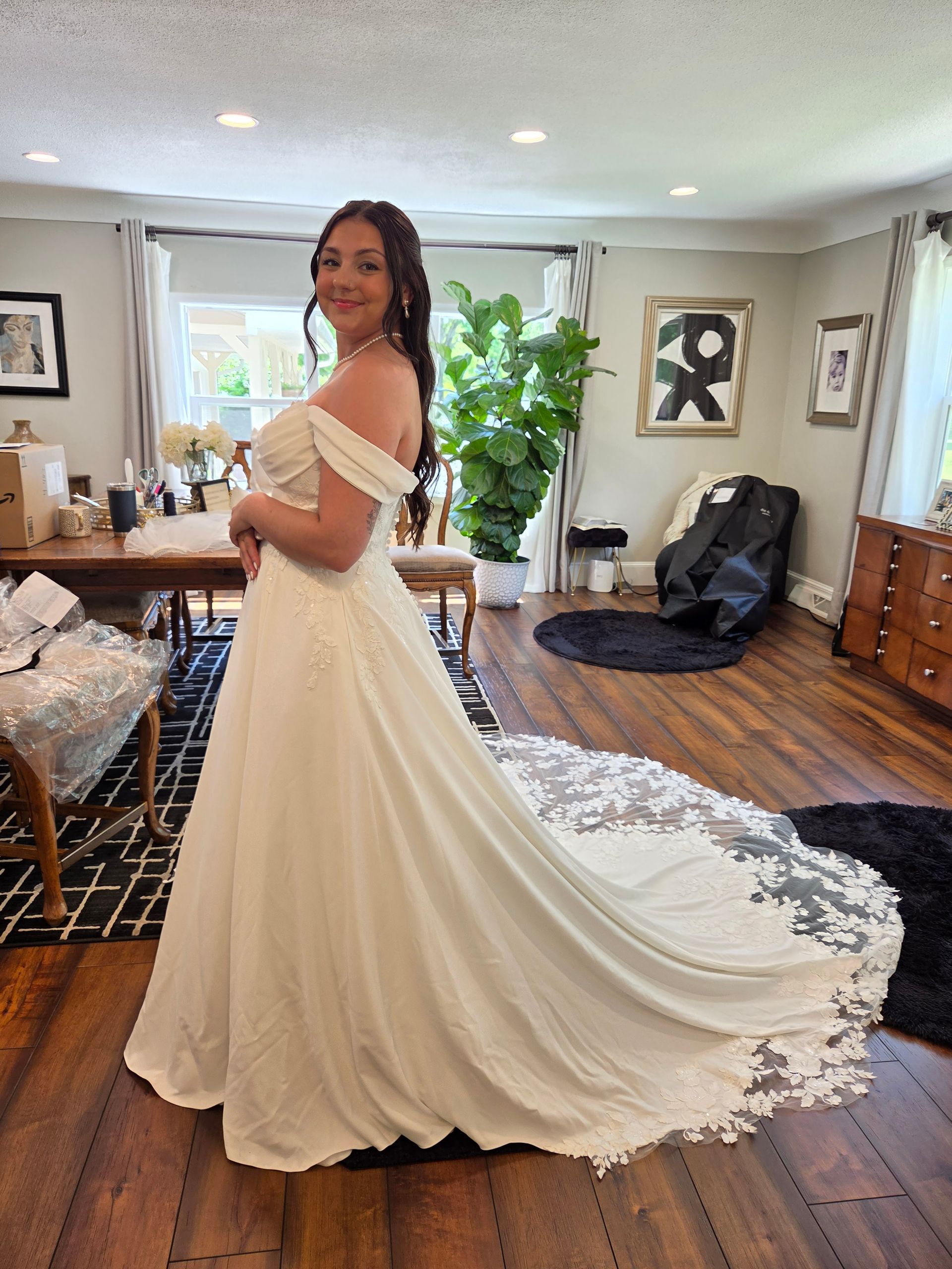 Woman in wedding gown at bridal fitting appointment with Sonya Garcia