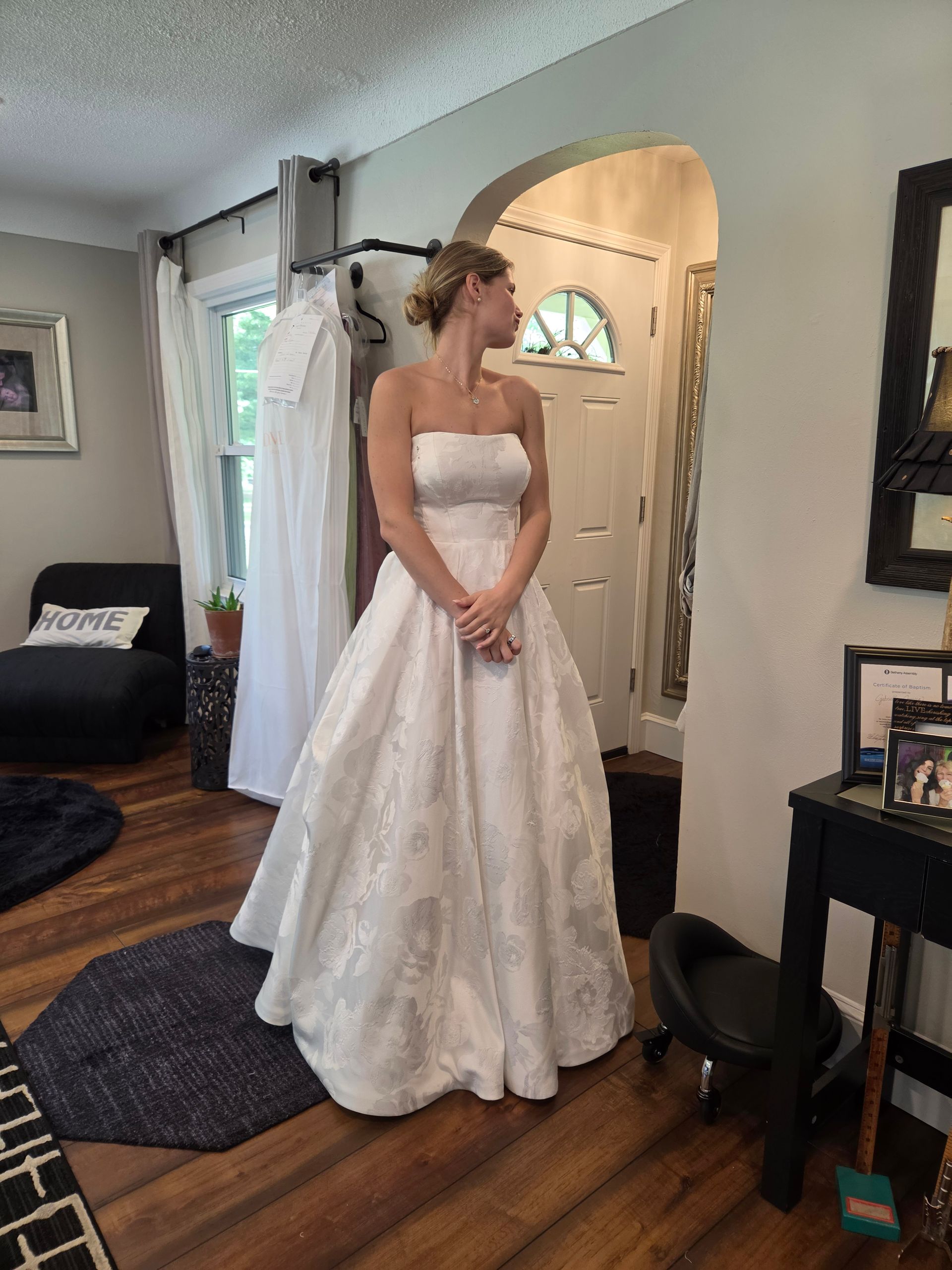 Woman in wedding gown at bridal fitting appointment with Sonya Garcia