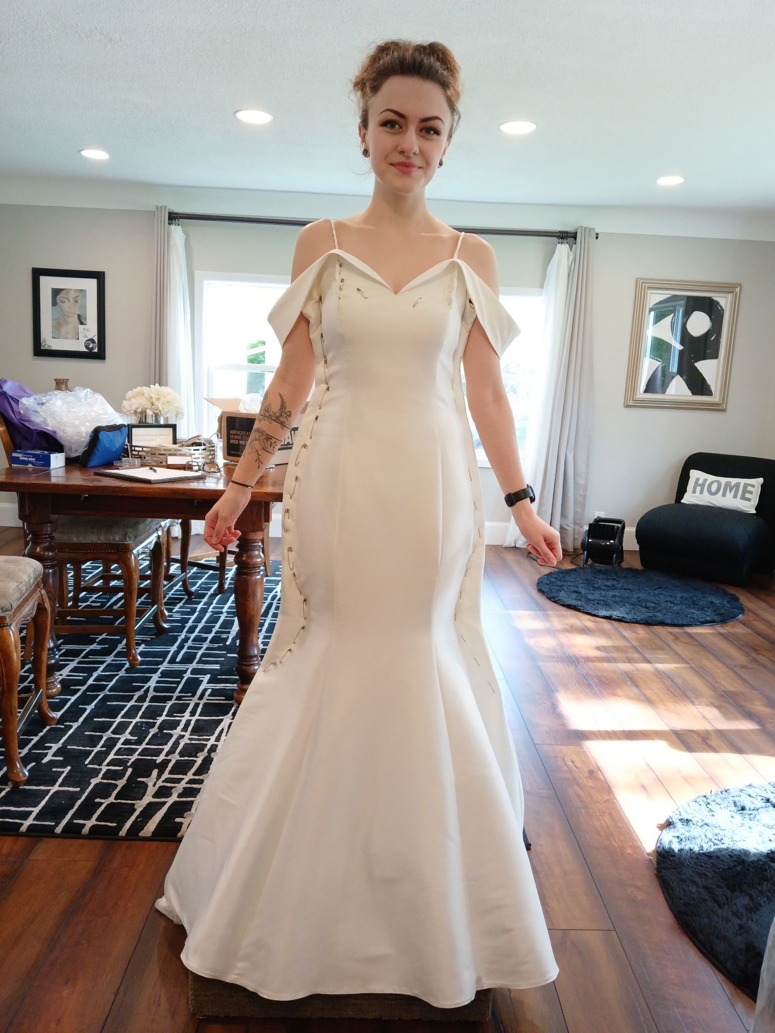 Woman in wedding gown at bridal fitting appointment with Sonya Garcia