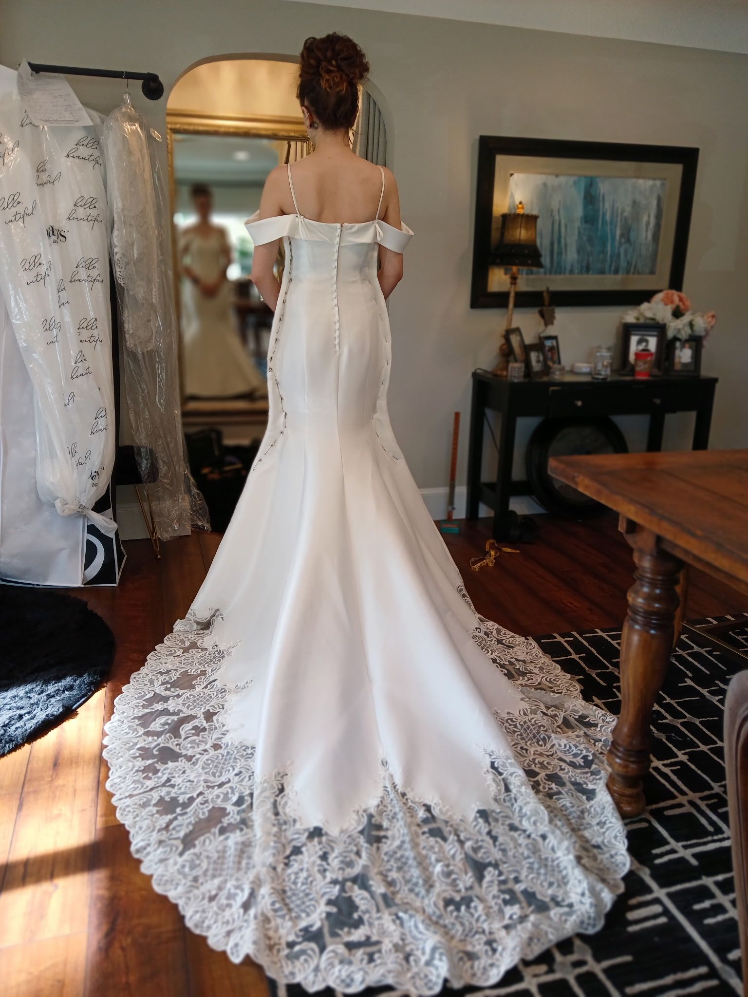Woman in wedding gown at bridal fitting appointment with Sonya Garcia