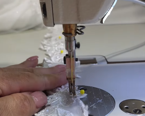 Sonya Garcia sewing custom wedding gown straps
