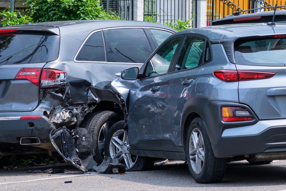A couple of cars that have been involved in a car accident.