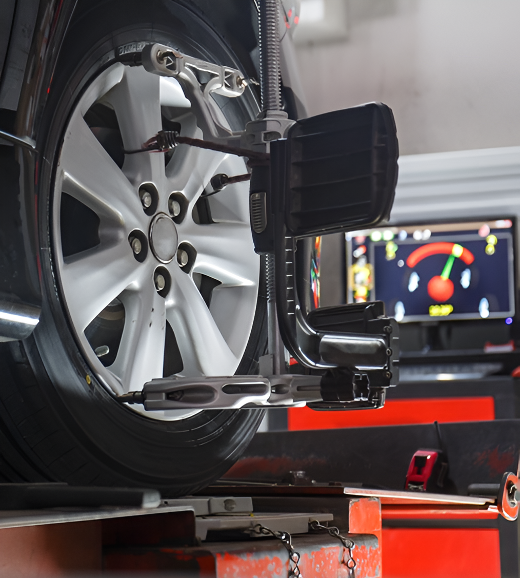 A Car Tyre Is Being Adjusted By A Machine — Border Bandag Tyre Service In South Albury, NSW