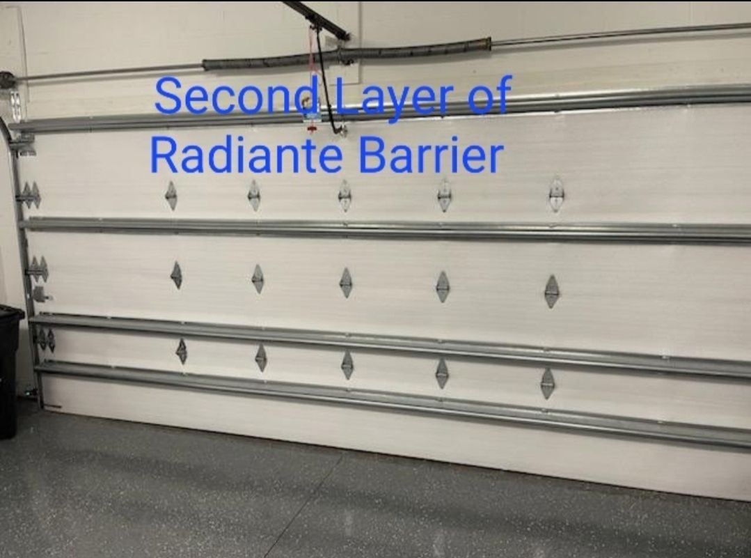 A garage door with the words second layer of radiante barrier on it
