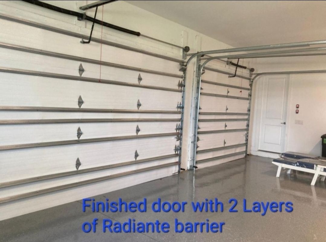 A garage with a finished door with 2 layers of radiante barrier