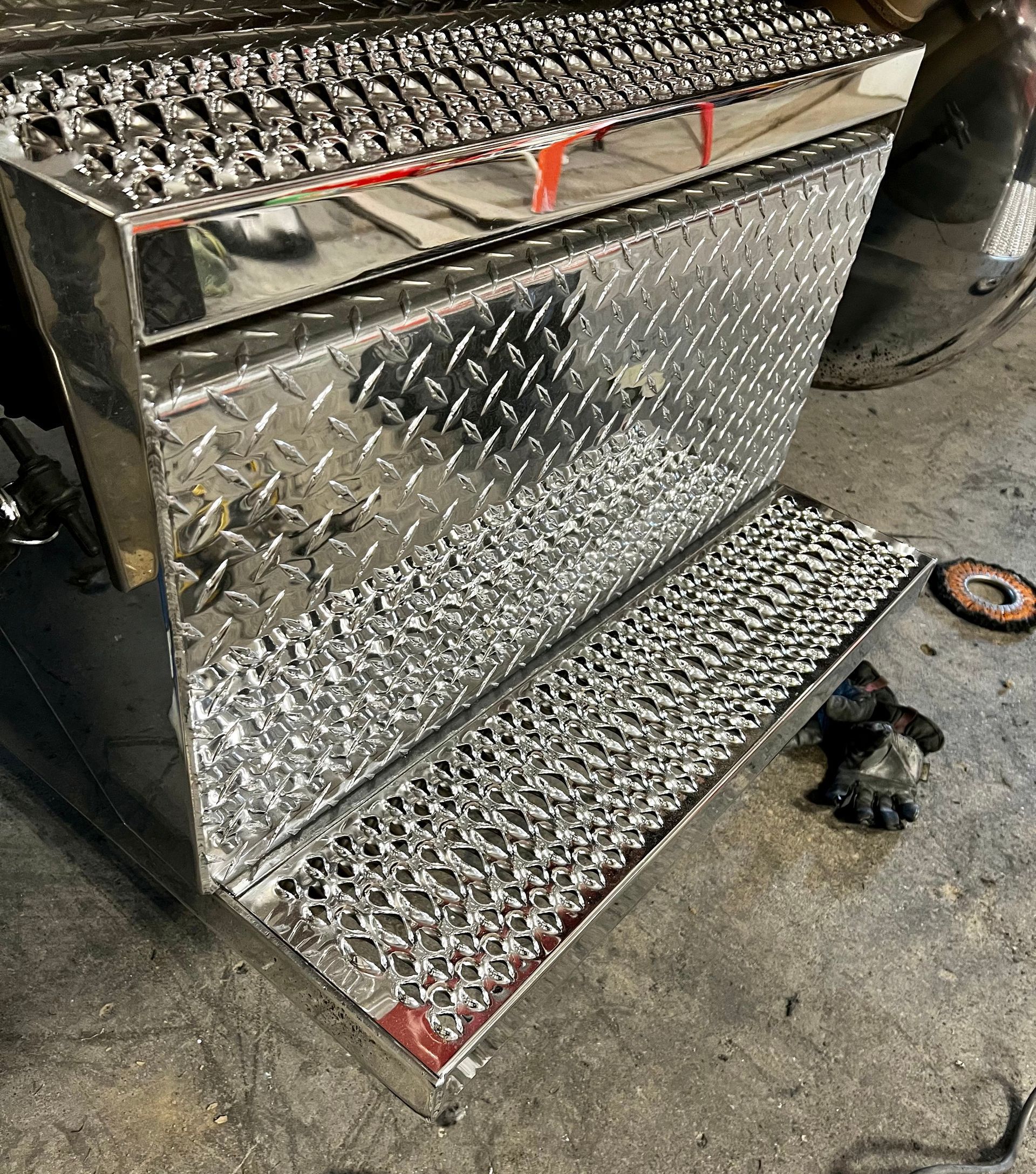 polished battery box step assembly Polished by Alberta Metal Polishing in Red Deer