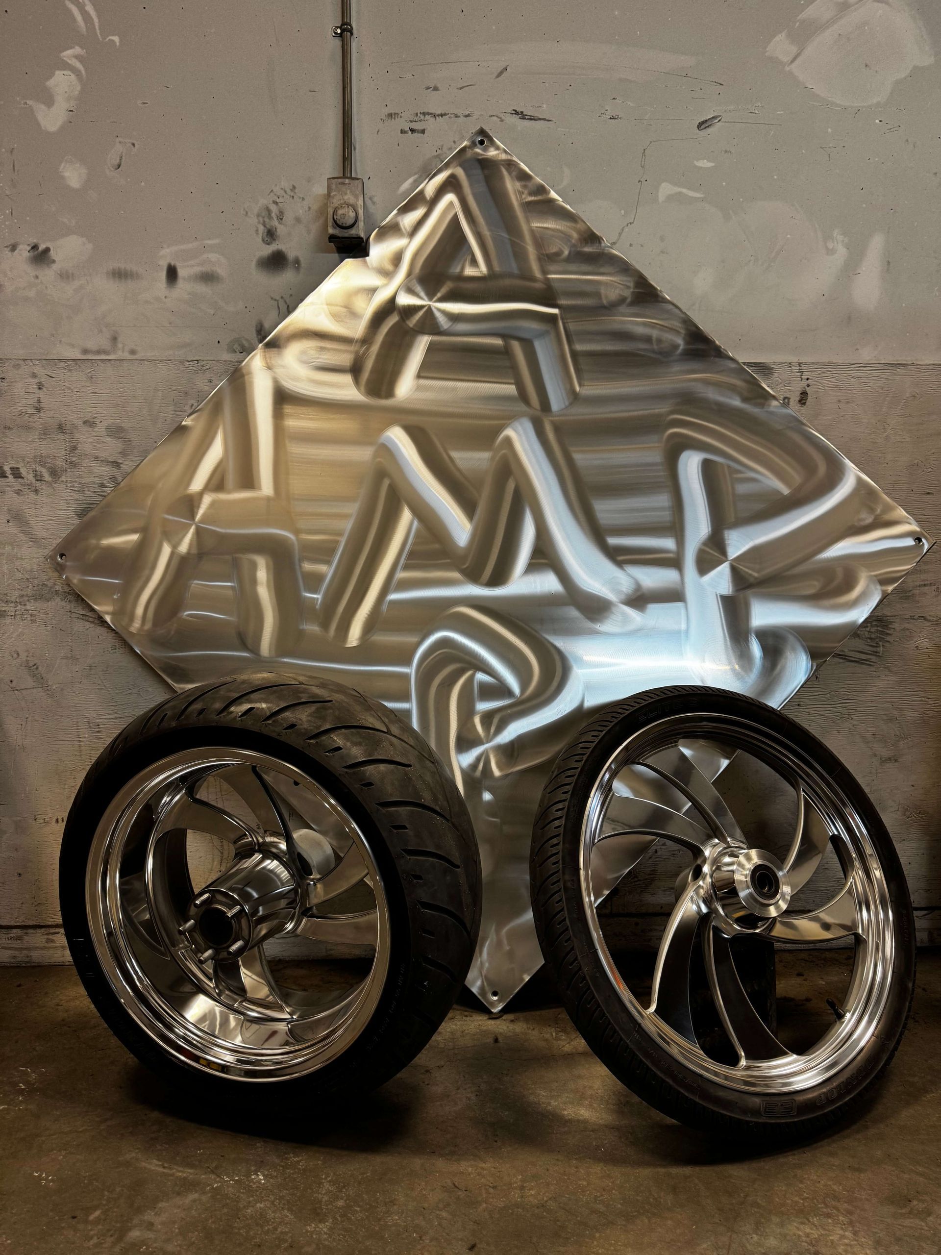 Motorcycle Wheels and Slab of Aluminum Polished by Alberta Metal Polishing in Nisku