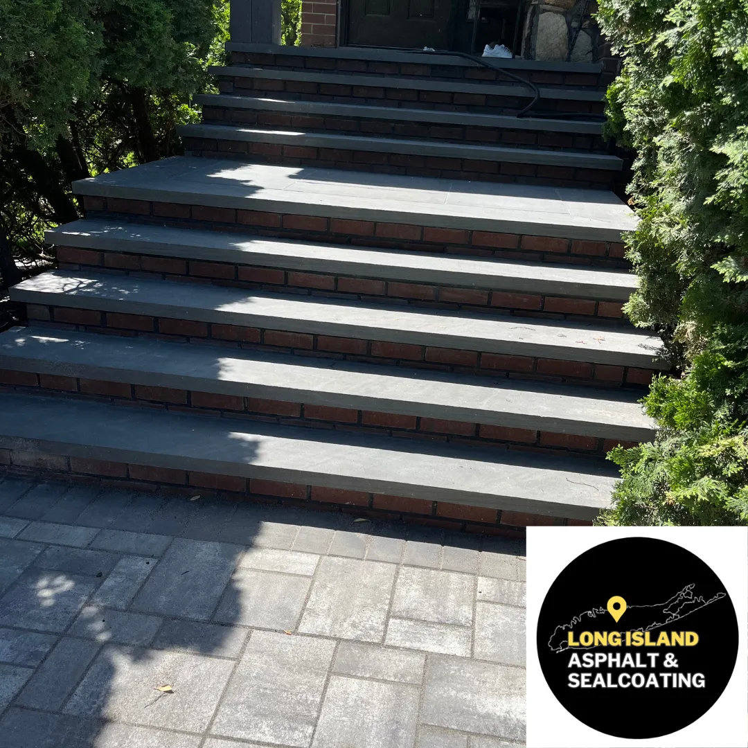 Stone steps leading up, bordered by greenery, and logo in the corner.