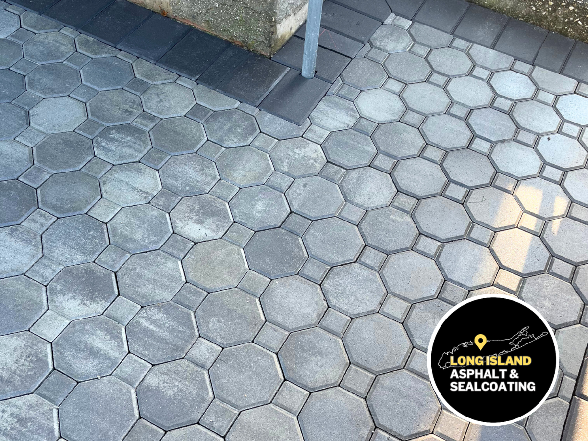 Brick pavers being installed for a masonry walkway. Brown and tan bricks with a brown border.