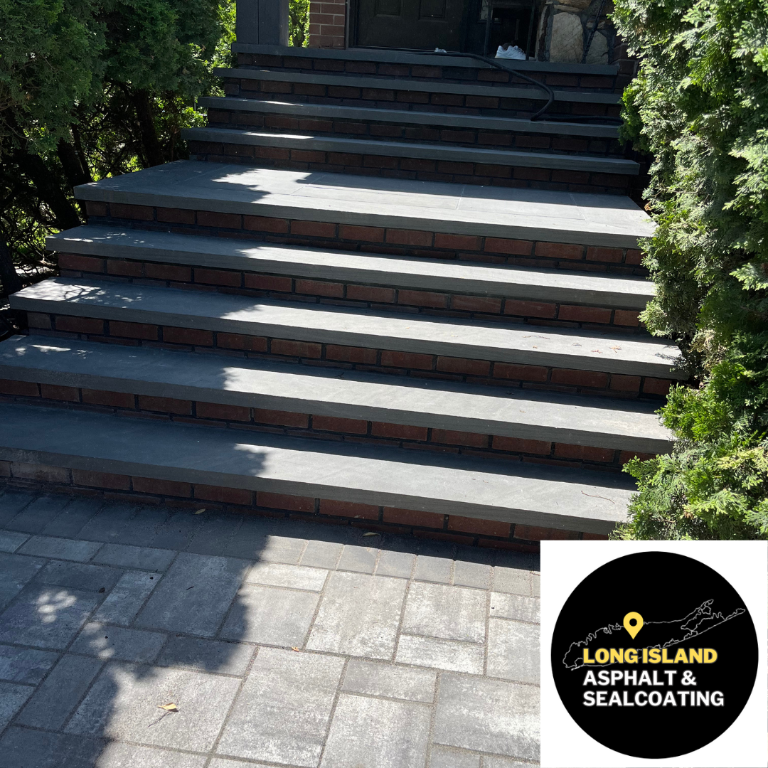 Stone steps with brick risers and patterned pavers. 