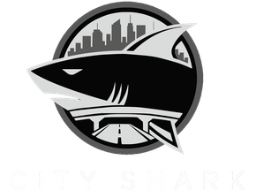 Black-and-silver shark logo in a circular emblem with a city skyline in the background