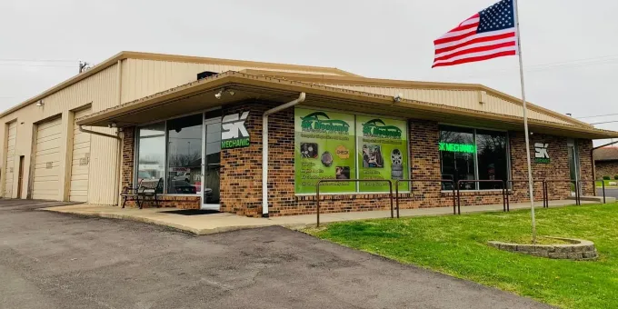 Exterior of a business with an American flag | SK Mechanic