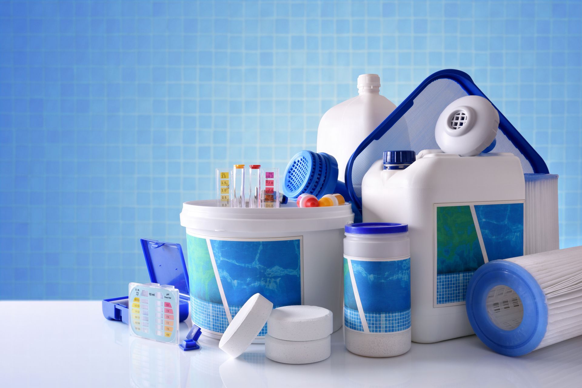 Various pool maintenance supplies, including test kits and chemicals.