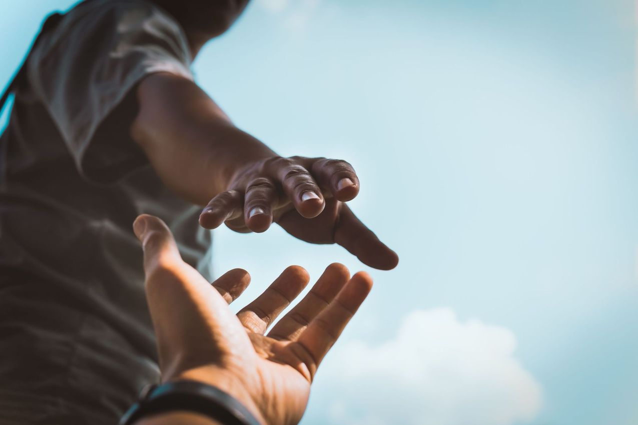 help concept hands reaching out each