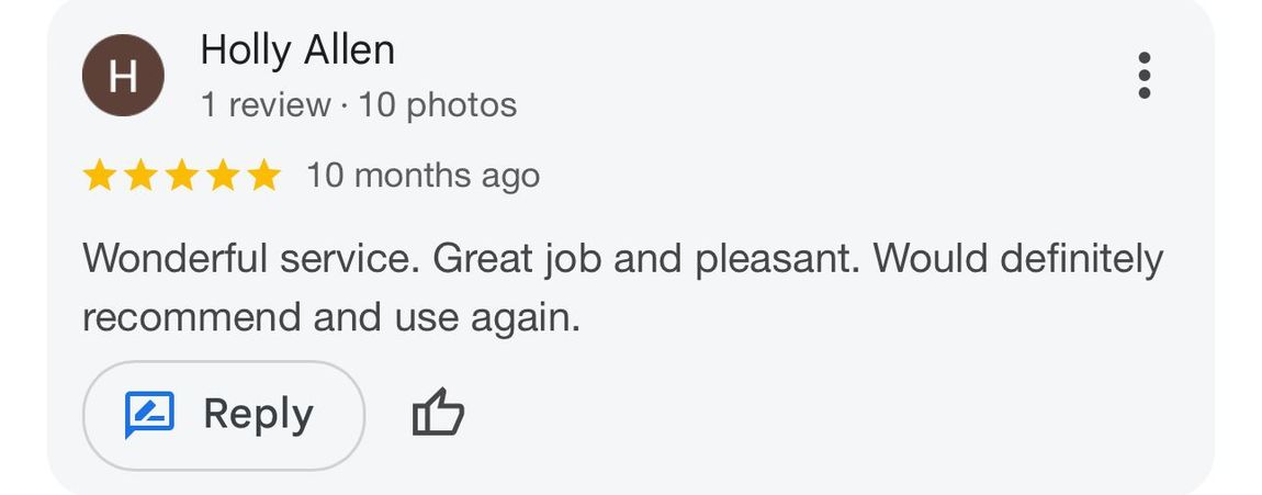 A screenshot of a google review with a reply button.