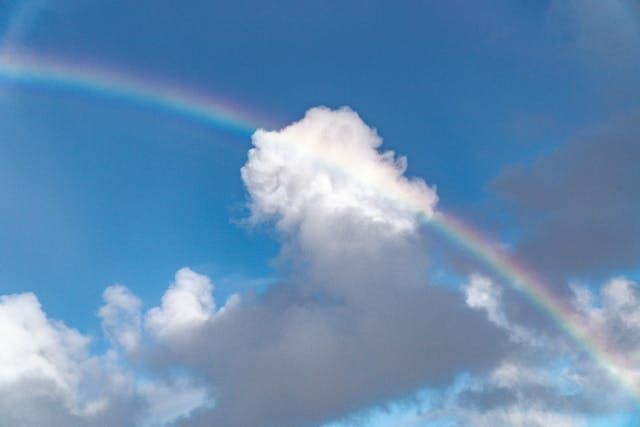A rainbow stretching across soft clouds brings a peaceful touch to cremation services Taneytown, MD