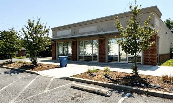 A neat commercial business property in Harrisonburg featuring professionally trimmed and pruned landscaping trees.