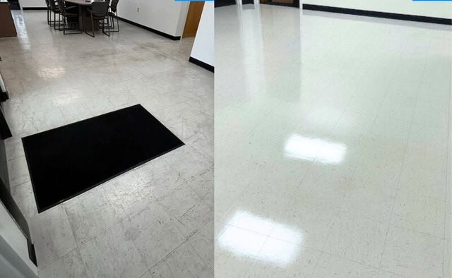 Hallway with a black floor mat on tile, shown beside a glossy white floor surface.